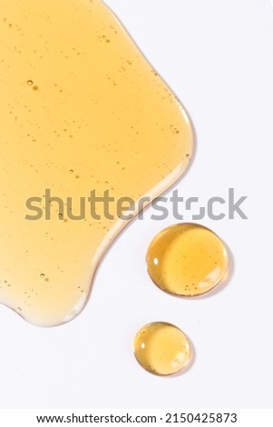 Liquid cosmetic gel or serum texture smudge yellow Royalty-Free Stock Photo #2150425873