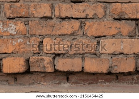 Old brick wall texture. Terracotta brick closeup.