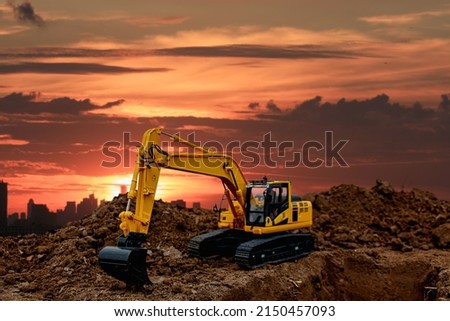 Excavators  are digging soil with  in the construction site on sunbeam  background