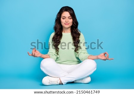 Full body photo of sleep mature lady sit wear shirt pants sneakers isolated on blue color background
