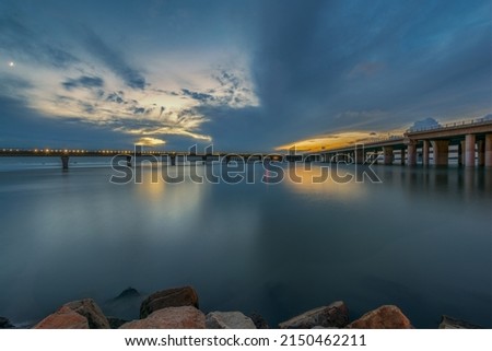 Spectacular sky and trestle in the evening Royalty-Free Stock Photo #2150462211
