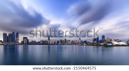 On the river the neon lights of the city are reflected Royalty-Free Stock Photo #2150464575