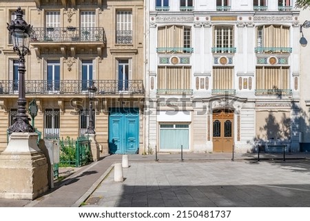 Paris, typical facades, beautiful buildings with old zinc roofs, rue Fenelon