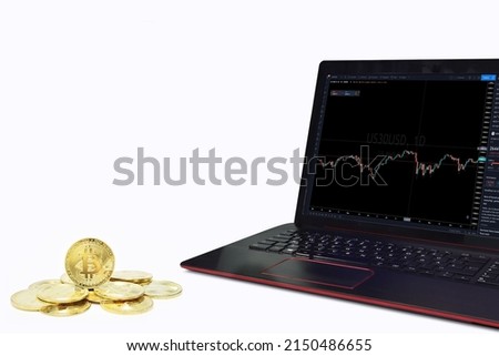 A screen with Bitcoin Trading Forex graph, and golden Bitcoin coins isolated on white background