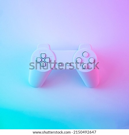 Holographic game joystick with purple blue gradient. Minimal retro wave or synthwave concept. Single object with color lights. Flat lay. Royalty-Free Stock Photo #2150492647