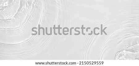 Transparent clear white water surface texture with ripples, splashes. Abstract summer banner background Water waves overlay with copy space, top view Cosmetic moisturizer micellar toner emulsion Royalty-Free Stock Photo #2150529559
