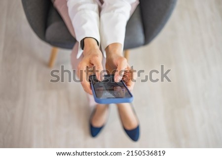 Surfing the net. Close up hand of business woman using smart phone with copy space. Woman work using cell phone hand holding mobile texting message contact us
