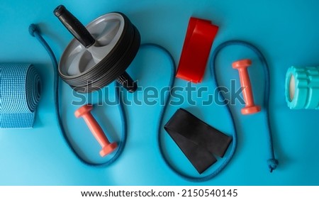 Sports equipment for fitness. Fitness and healthy lifestyle. Blue background. Royalty-Free Stock Photo #2150540145