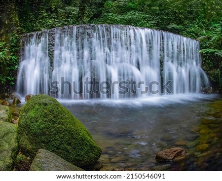very beautiful landscape, hidden waterfall in the middle of the forest. 