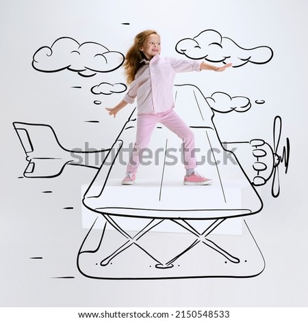Conceptual artwork. Little girl flying on drawn plane. Inspiration world for kids. Concept of emotions, ideas, imagination, international children's day. Happy kid dreaming, studying, having fun