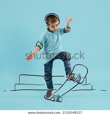Creative portrait of cute kid, little boy skating on drawn skateboard isolated on blue background with pencil sketch. Concept of emotions, ideas, imagination, international children's day. Royalty-Free Stock Photo #2150548537