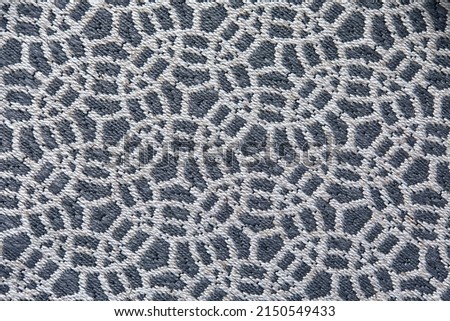 Abstract circular print background on cotton fabric in gray tone