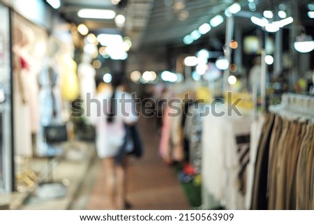 Defocused picture of night flea market with bokeh light background. Picture was blurred in purpose