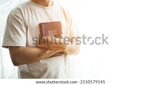 The Bible is in hand, praying by hand and praying together. with religious faith and belief in god on blessing background The power of hope or love and devotion. Royalty-Free Stock Photo #2150579145