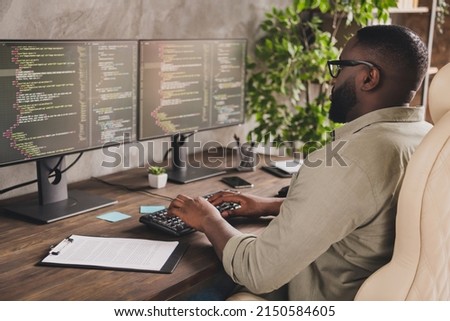 Profile photo of smart serious web designer keyboard writing implement sit chair workstation office indoors