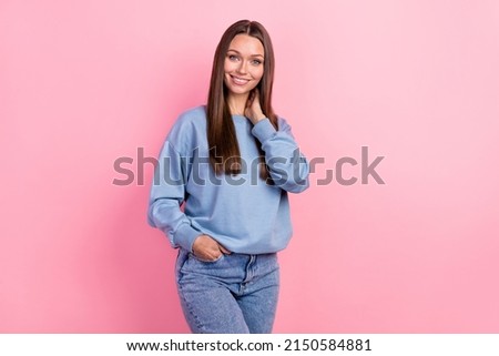 Portrait of attractive cheerful girly girl wearing cosy clothes posing copy space isolated over pink pastel color background