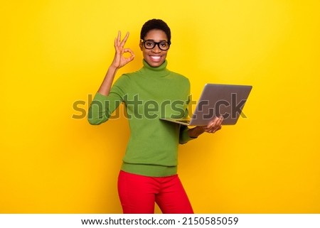 Photo of cool funny short hair lady dressed green turtleneck chatting modern gadget okey sign isolated yellow color background