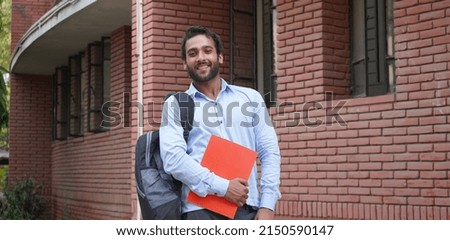 indian College student happy images with Books at university or college campus Royalty-Free Stock Photo #2150590147