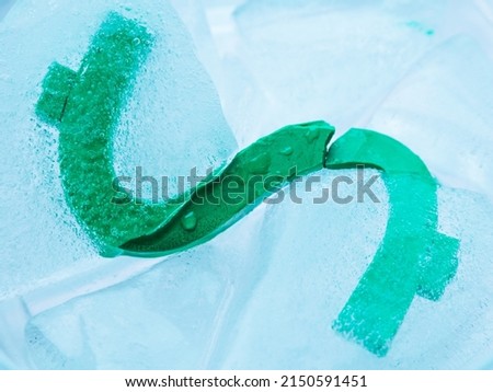 the dollar sign is released from the ice. lifting of sanctions or unfreezing of bank accounts. Selective focus
