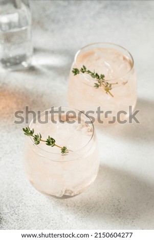 Boozy Pink Rose Wine Spritzer with Ice and Thyme