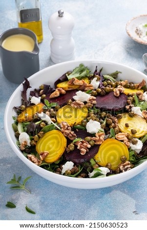 Beet salad with red and yellow beets with lemon dressing and crunchy roasted chickpeas Royalty-Free Stock Photo #2150630523
