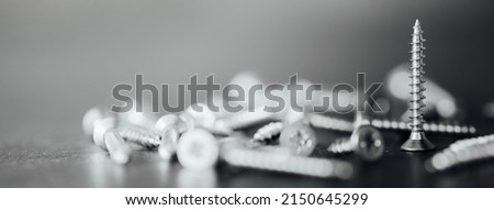 Macro photo of screws. Set of screws. Construction abstraction. Industrial background. Screws macro photo, screw background, steel screw, screw macro. Royalty-Free Stock Photo #2150645299