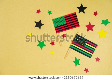 Black Liberation African American flags and stars on yellow background. Black History Month. 19th of july, Juneteenth African American Holiday Celebrating Freedom