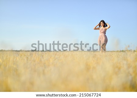 beautiful asian girl and grass field in sunset of summer