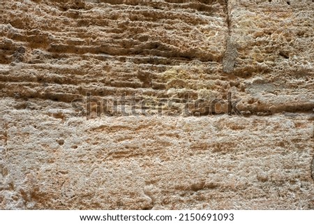 photo background of an old stone wall with destruction