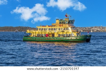 Ferry on Sydney Harbour NSW Australia.  Lovely colours of the Sky and water Royalty-Free Stock Photo #2150701597
