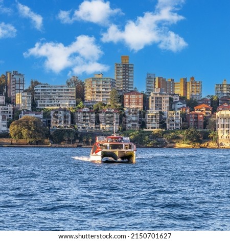 Sydney CBD skyline, residential and commercial buildings on the harbour waters NSW Australia