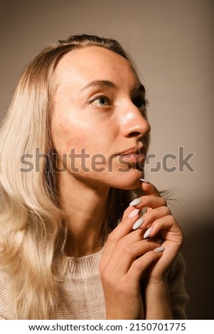 A young woman with a very sad face crossed her arms and prayed. Royalty-Free Stock Photo #2150701775
