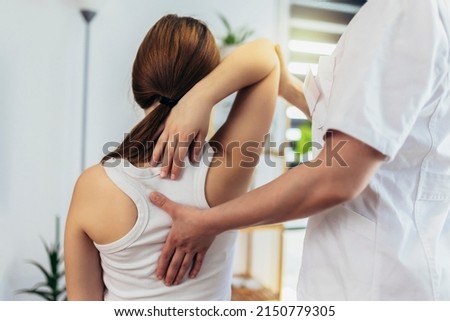 Teen Girl having chiropractic back adjustment. Osteopathy, Physiotherapy, Kinesiology. Bad posture correction Royalty-Free Stock Photo #2150779305