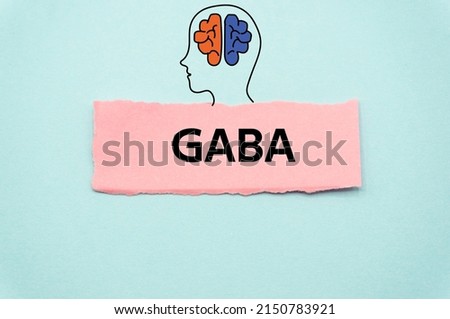 GABA.The word is written on a slip of colored paper. Psychological terms, psychologic words, Spiritual terminology. psychiatric research. Mental Health Buzzwords. Royalty-Free Stock Photo #2150783921
