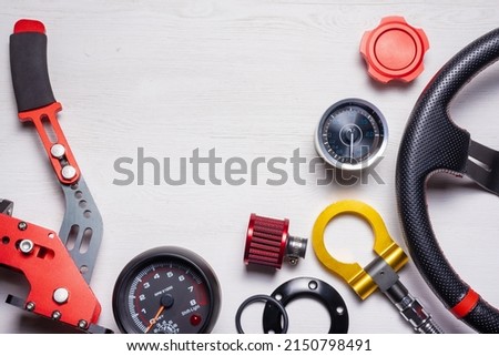 Car tuning gear concept flat lay background with copy space. Motorsport equipment. Royalty-Free Stock Photo #2150798491