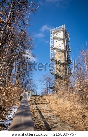Lookout tower in galyateto, winter forest.Translation:"National Blue Trail"