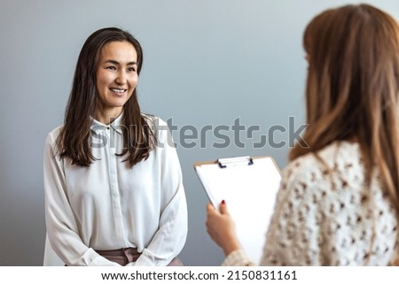 Successful therapy. Young female client having consultation with psychologist, grateful for professional help at clinic. Shot of a young woman having a therapeutic session with a psychologist