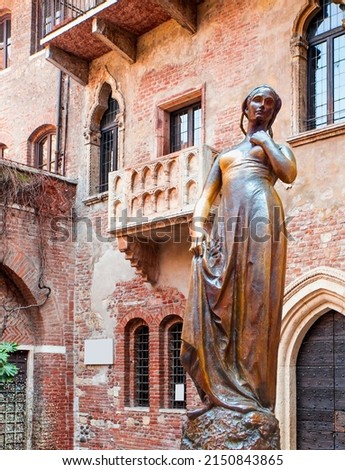 Bronze statue of Juliet and balcony by Juliet house - Verona, Italy Royalty-Free Stock Photo #2150843865