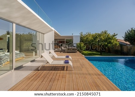 Modern villa with pool and deck with interior and exterior views