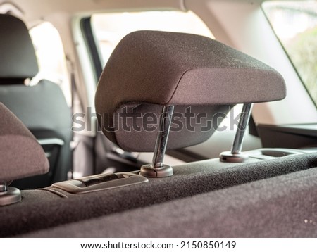 close up of rear auto adjustable head restraint fitted into the top of the rear seats Royalty-Free Stock Photo #2150850149