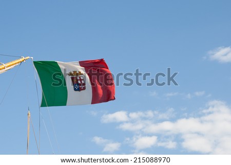 Nautical flag of Italy over a blue sky background