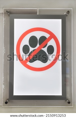 "No animals allowed" sign at a shopping center. Image of a sign "No enter with pets". Do not enter with dogs. Space for text. Royalty-Free Stock Photo #2150913253