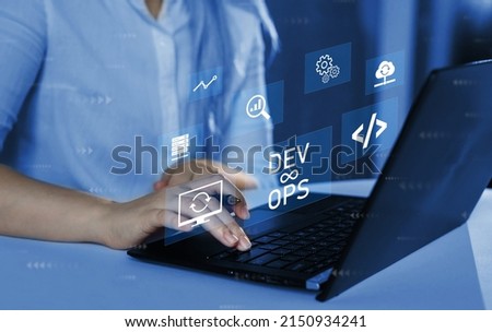 Agile programming and DevOps concept. Engineer working on laptop with virtual screen. IT operations, high software quality and software development. Royalty-Free Stock Photo #2150934241