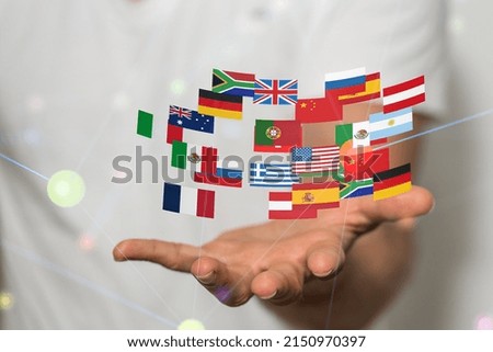 A hand with colorful flag illustrations above on a blurred background