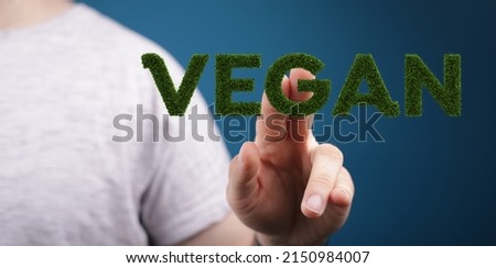 A person's hand showing illustrated Vegan in a presentation  Organic production concept
