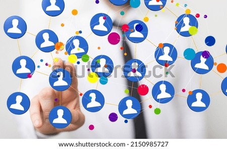 A network graphic with a person's hand touching it from the background