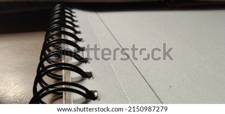 Book binding with spiral spring, spiral binding, spring, sketch book Royalty-Free Stock Photo #2150987279