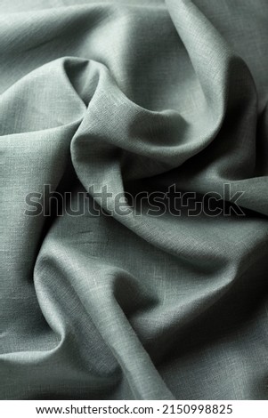 Texture with linen fabric in green color, selective focus image