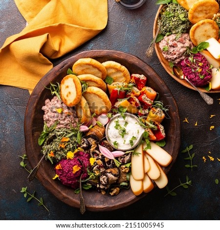 Vegetarian appetizers platter Georgian cuisine, bread, dips and cheese Royalty-Free Stock Photo #2151005945