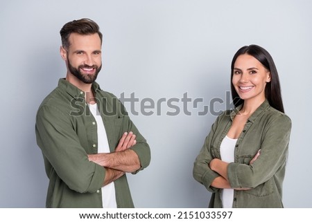 Profile side view portrait of attractive content cheerful couple colleagues folded arms isolated over grey pastel color background
